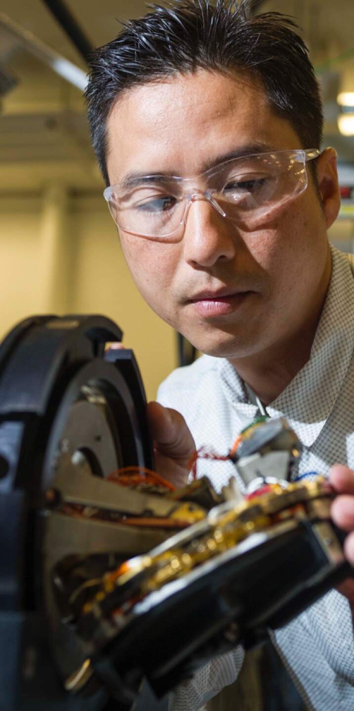 a man wearing glasses and looking at the camera